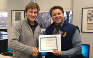 Ryan Linker '14 and Mr. Hess celebrate after Ryan was awarded $250 for his car detailing business. 