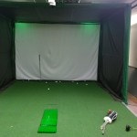 The golf simulator under the stage is hidden from view for most of the school community. 