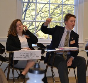 Sam Watters ‘18 delegating. The young lady to his right is clearly impressed. Photo Credit: Peter Corrigan