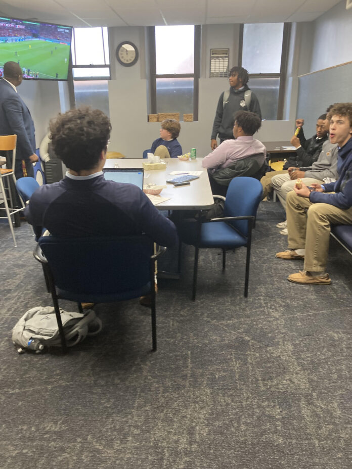 Mr. Brooks hosts a watch party in the Multicultural Room.